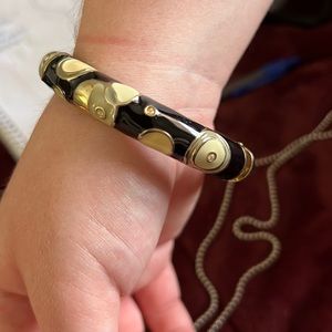 Modern hinged, bangle, cream, and black and gold colors